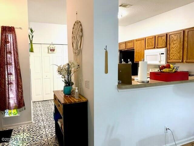 7823 Melvin Road Jacksonville, FL 32210 - Photo 9 of 36 Hallway/Kitchen