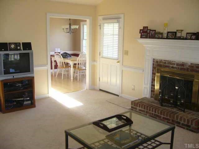 6008 Swales Way Raleigh, NC 27603 - Photo 5 of 11 a living room with furniture and a fireplace
