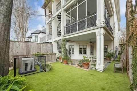 a view of a house with backyard and porch