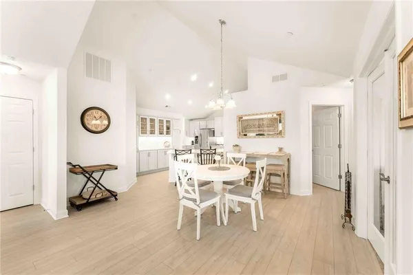 a view of a dining room with furniture and a rug