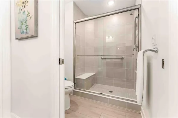 a bathroom with a glass shower door