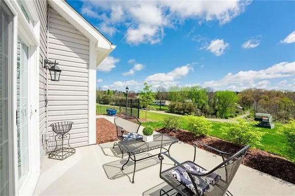 a view of a patio with a yard