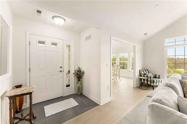 a living room with furniture and a window