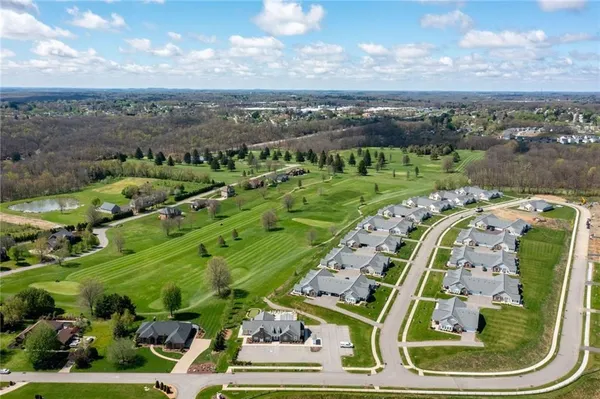 an aerial view of a golf course with outdoor space