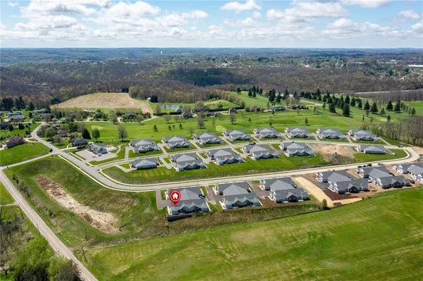 a view of a golf course with an outdoor space