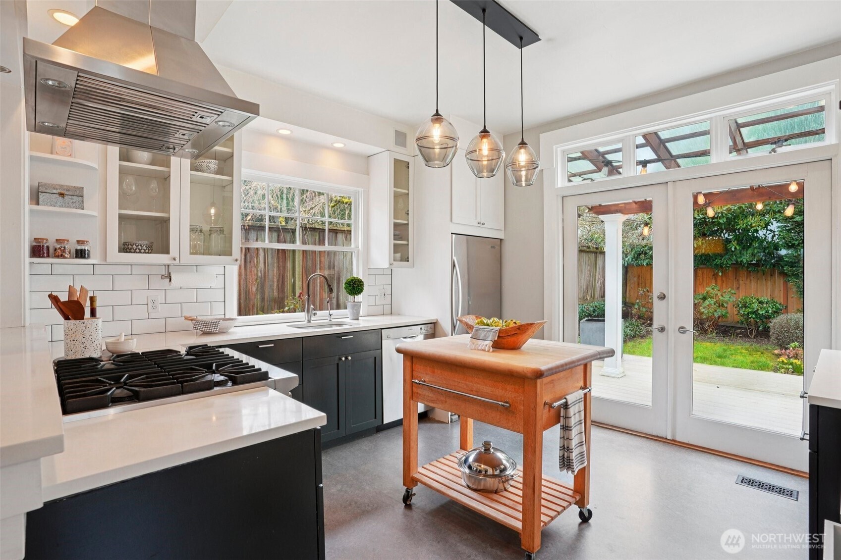 3141 Broadway East Seattle, WA 98102 - Photo 13 of 40 a kitchen that has a stove and a table in it