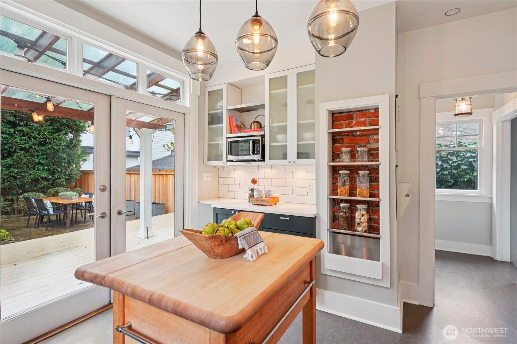 3141 Broadway East Seattle, WA 98102 - Photo 16 of 40 a view of a dining room with furniture a chandelier and wooden floor