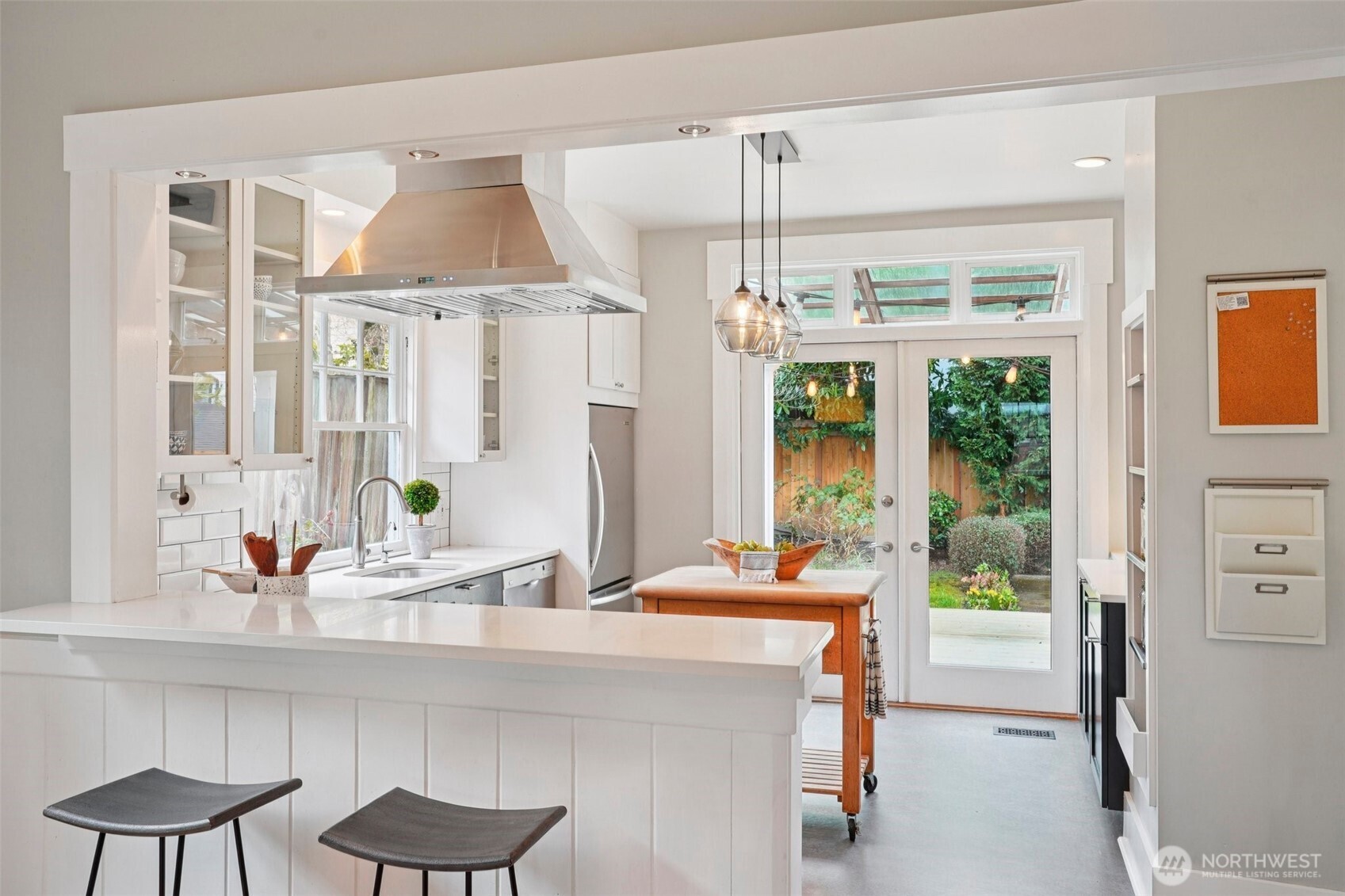 3141 Broadway East Seattle, WA 98102 - Photo 17 of 40 a room with a table chairs and a large window