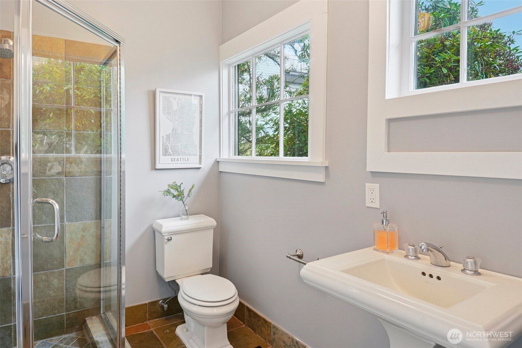 3141 Broadway East Seattle, WA 98102 - Photo 18 of 40 a bathroom with a sink a toilet and shower