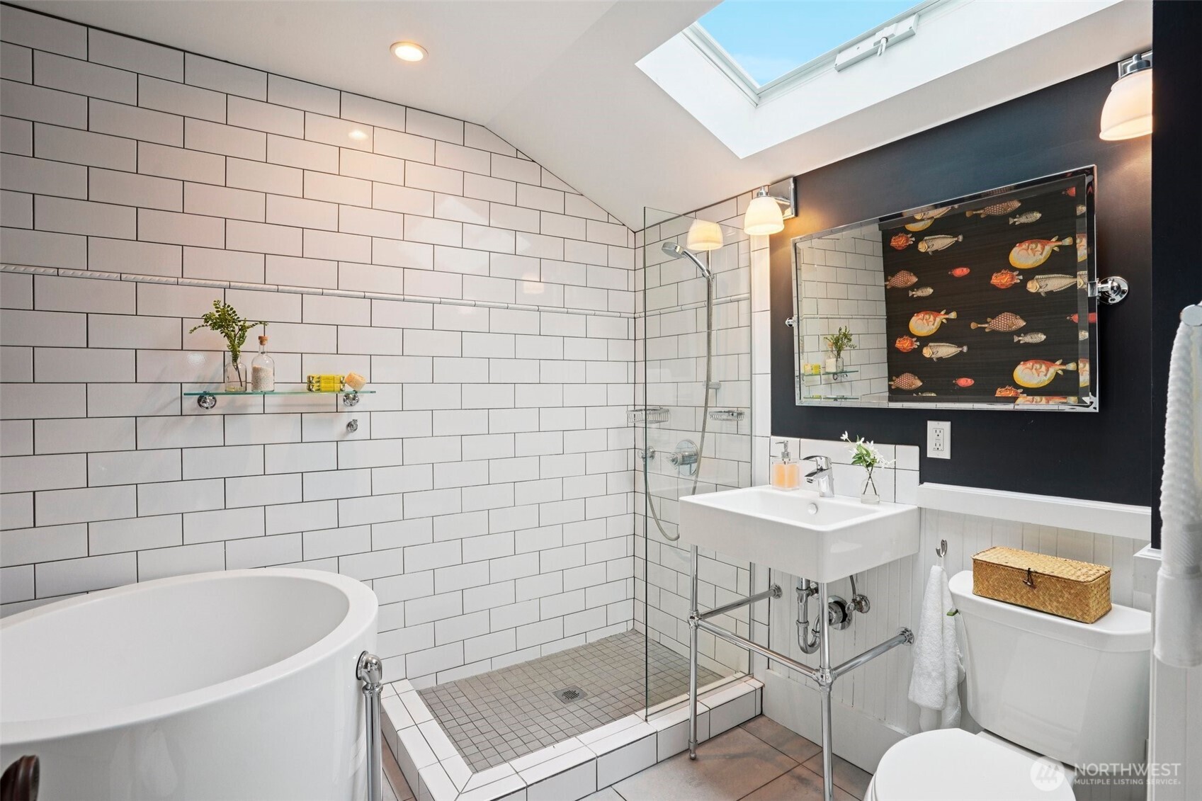 3141 Broadway East Seattle, WA 98102 - Photo 22 of 40 a bathroom with a sink a toilet and shower