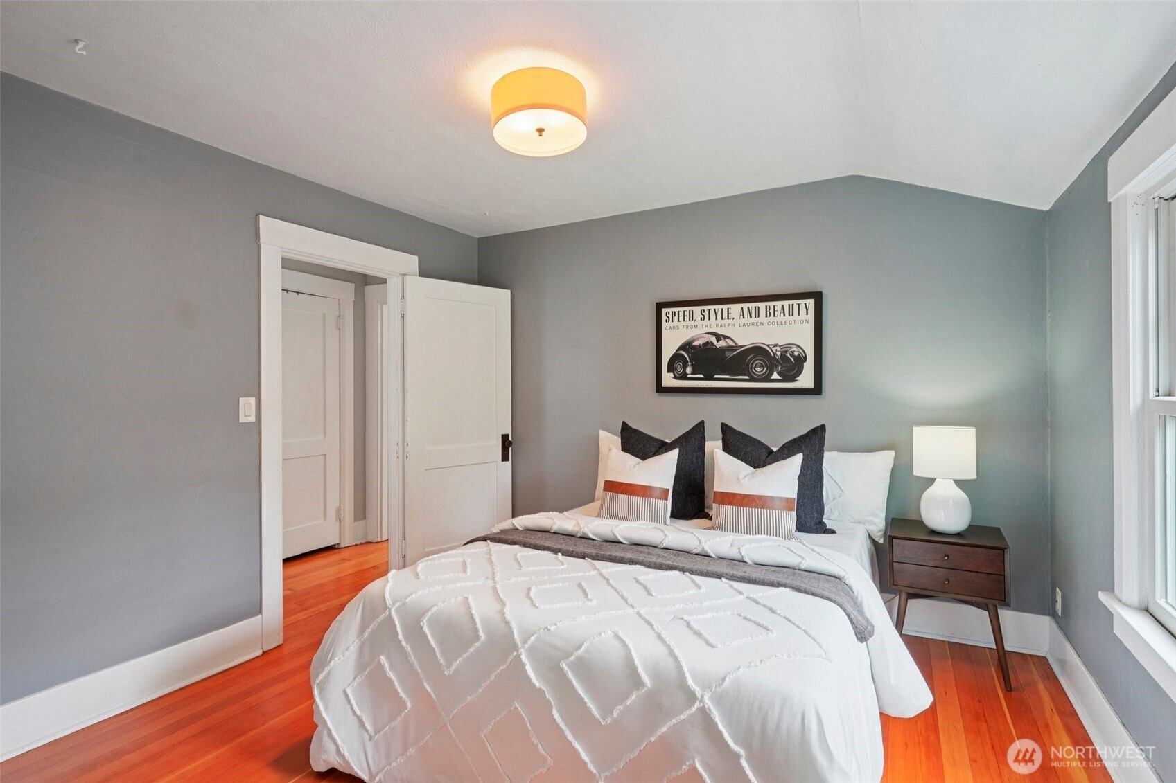 3141 Broadway East Seattle, WA 98102 - Photo 25 of 40 a bedroom with a bed and wooden floor