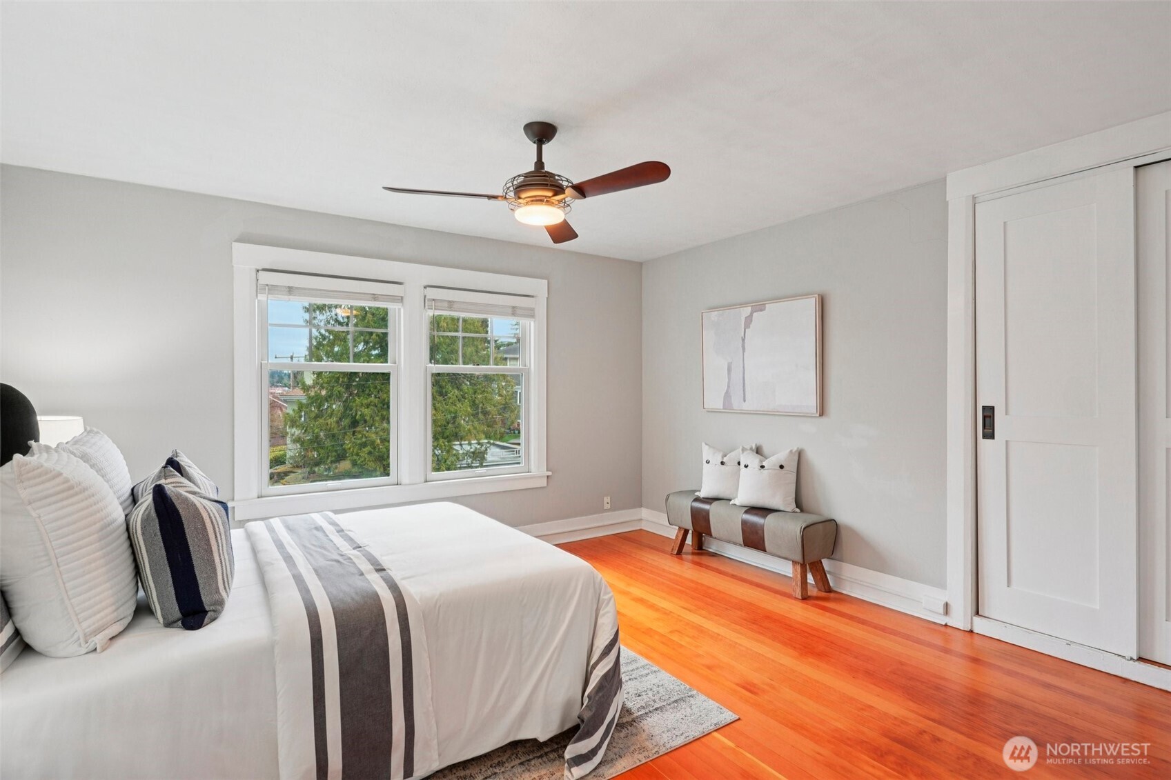 3141 Broadway East Seattle, WA 98102 - Photo 26 of 40 a bedroom with a bed and wooden floor