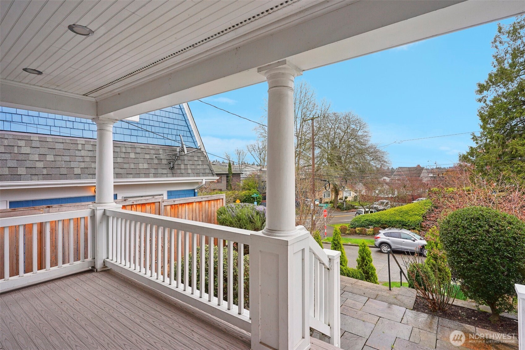 3141 Broadway East Seattle, WA 98102 - Photo 3 of 40 a view of a porch with wooden floor and iron stairs