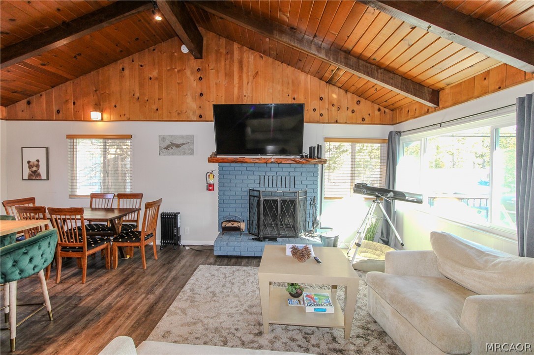 42830 Cougar Road, Unit UPPR Big Bear Lake, CA 92315 - Photo 5 of 21 a living room with furniture a flat screen tv and a fireplace