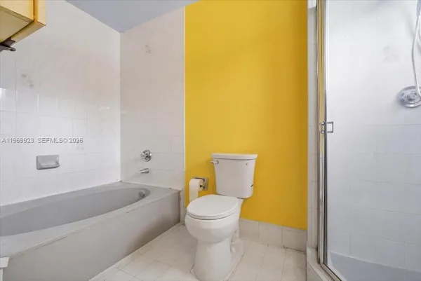 a bathroom with a toilet and a sink