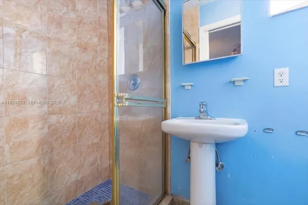a bathroom with a sink and mirror