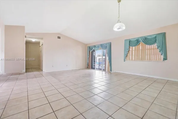 a view of an empty room and window