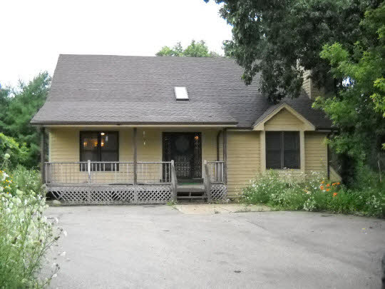 20364 Free Church Road Caledonia, IL 61011 - Photo 1 of 6 front view of a house with a yard