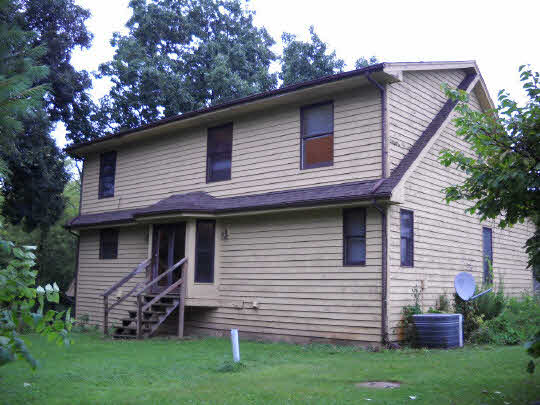 20364 Free Church Road Caledonia, IL 61011 - Photo 3 of 6 a front view of a house with a garden