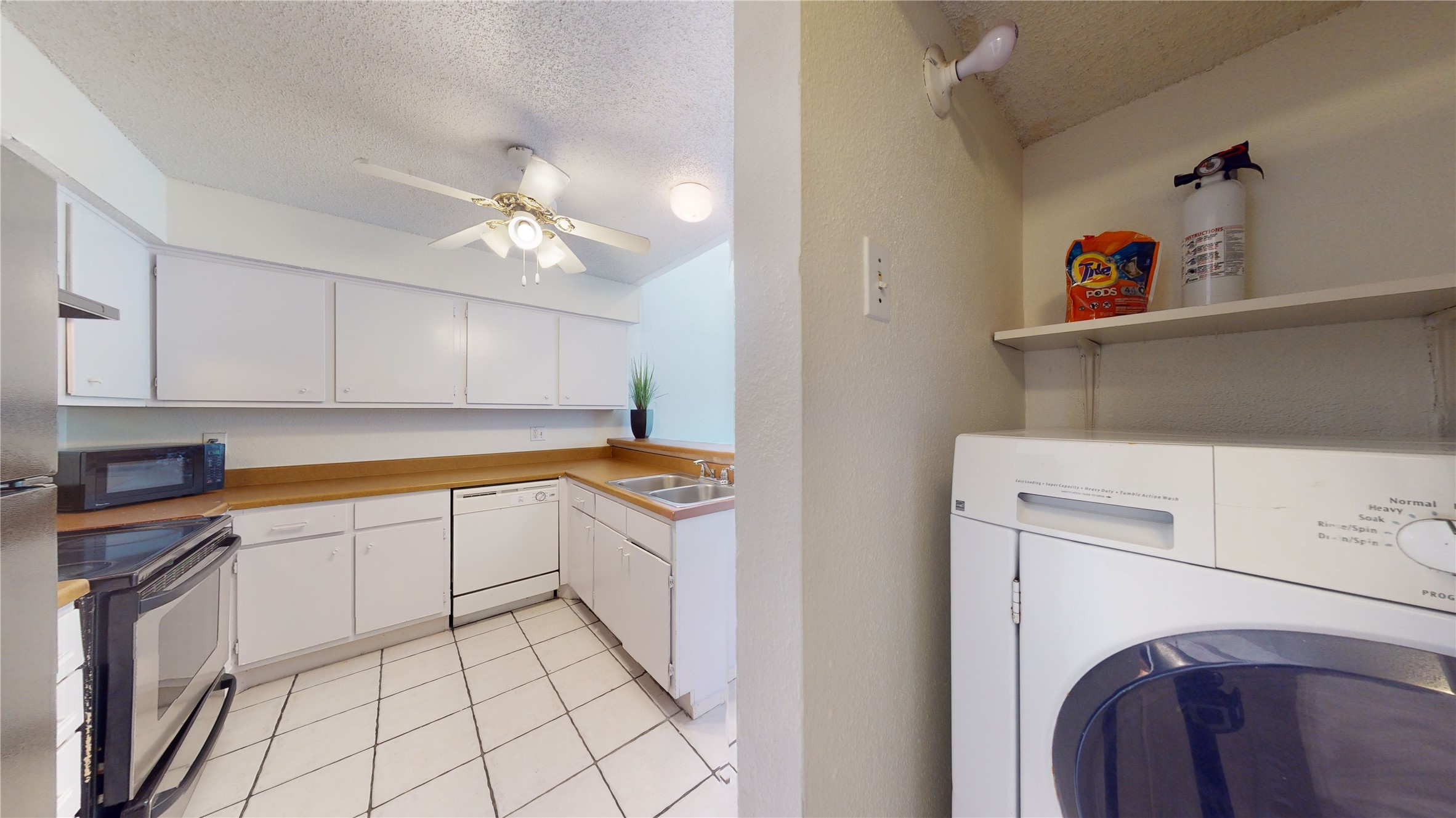 12250 Copper Tree Pvt Lane Houston, TX 77035 - Photo 6 of 26 Hallway to laundry area and kitchen