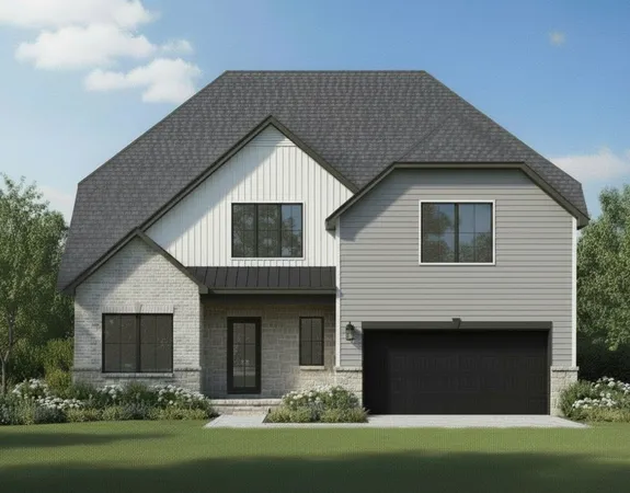 a front view of a house with a garden and yard