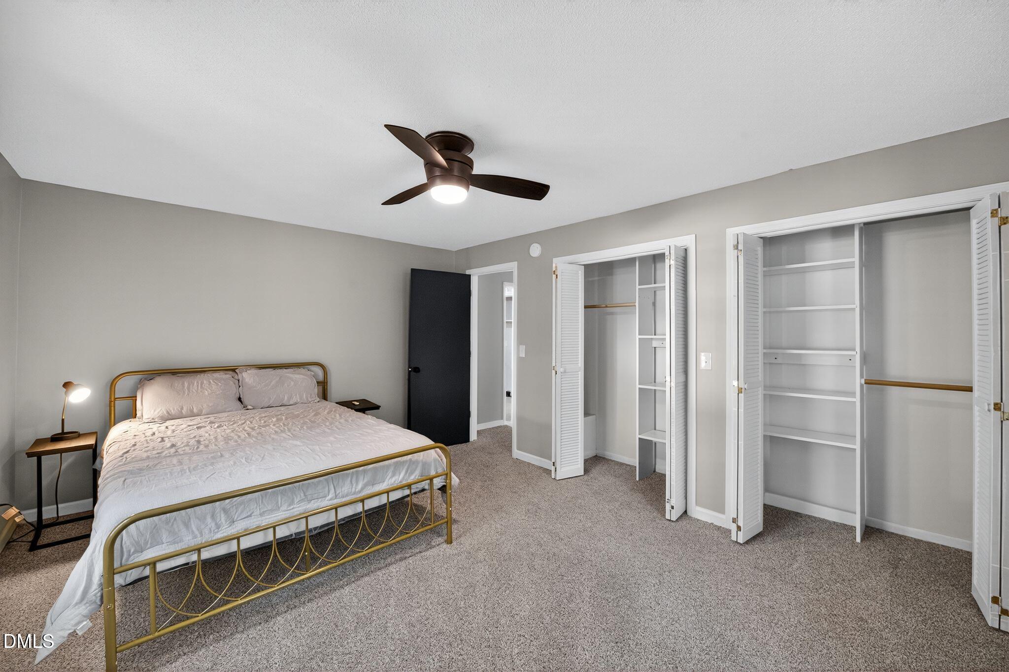 518 East 3rd Street Wendell, NC 27591 - Photo 13 of 30 a bedroom with a bed and a ceiling fan