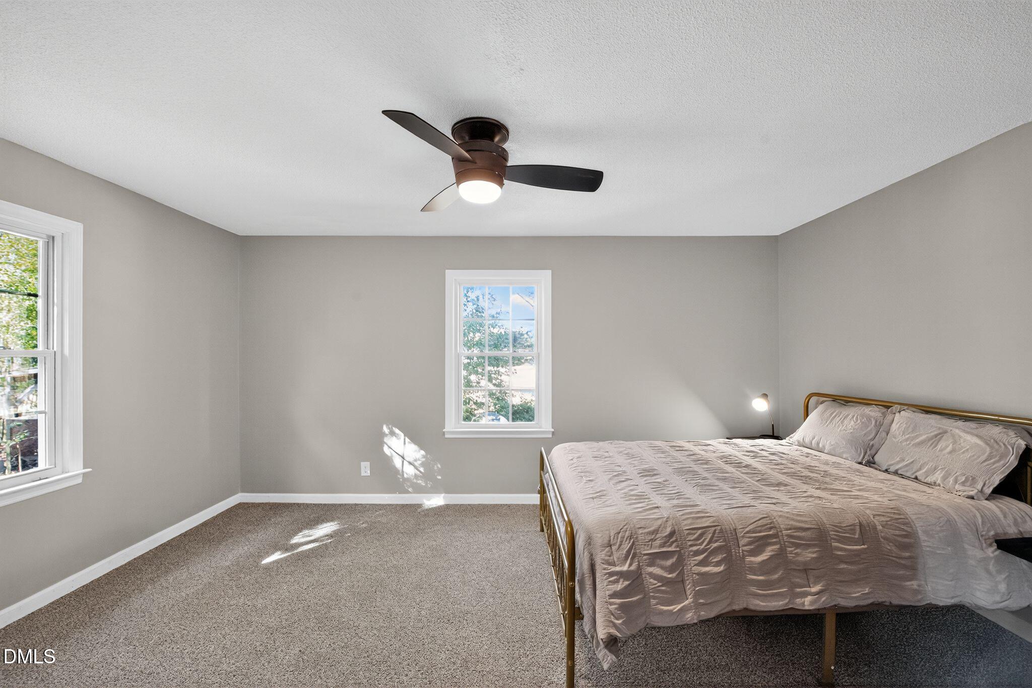 518 East 3rd Street Wendell, NC 27591 - Photo 14 of 30 a bedroom with a bed and a window