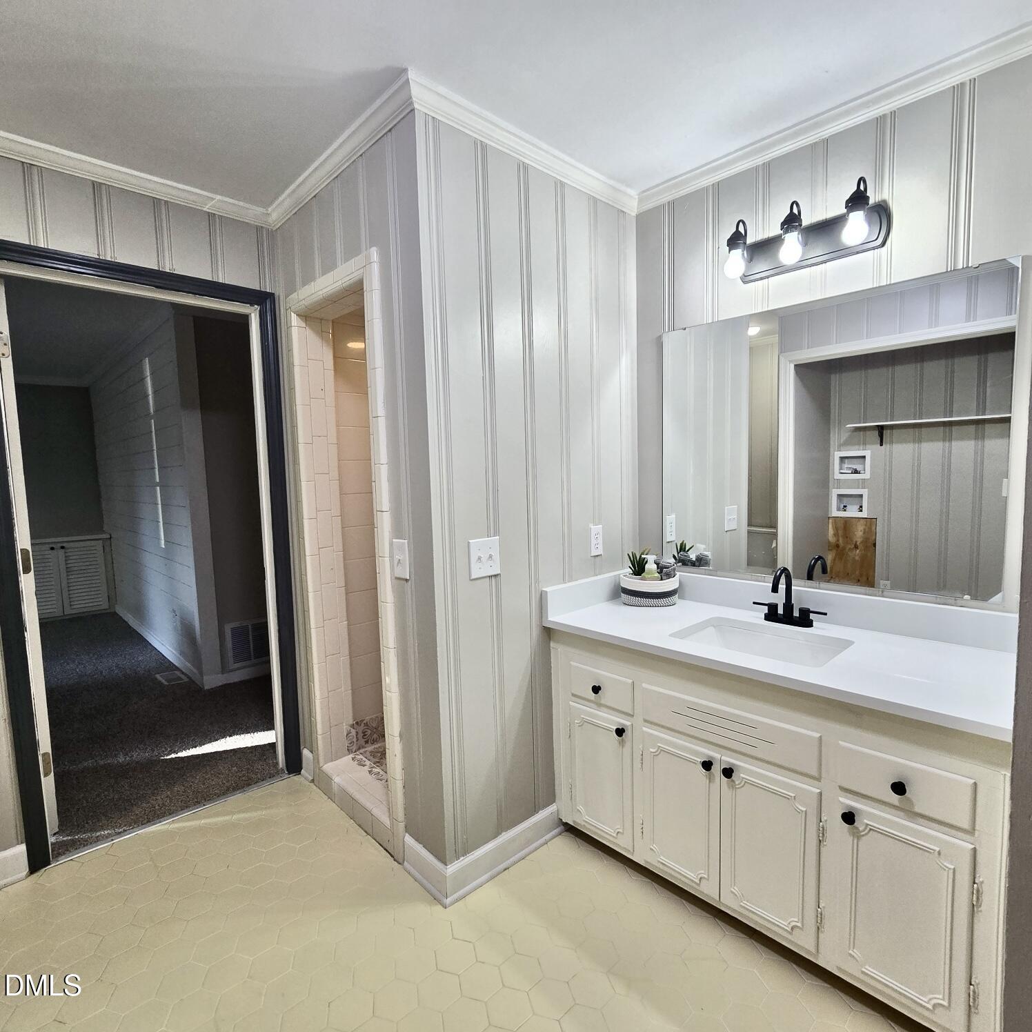 518 East 3rd Street Wendell, NC 27591 - Photo 17 of 30 a bathroom with a double vanity sink mirror and double