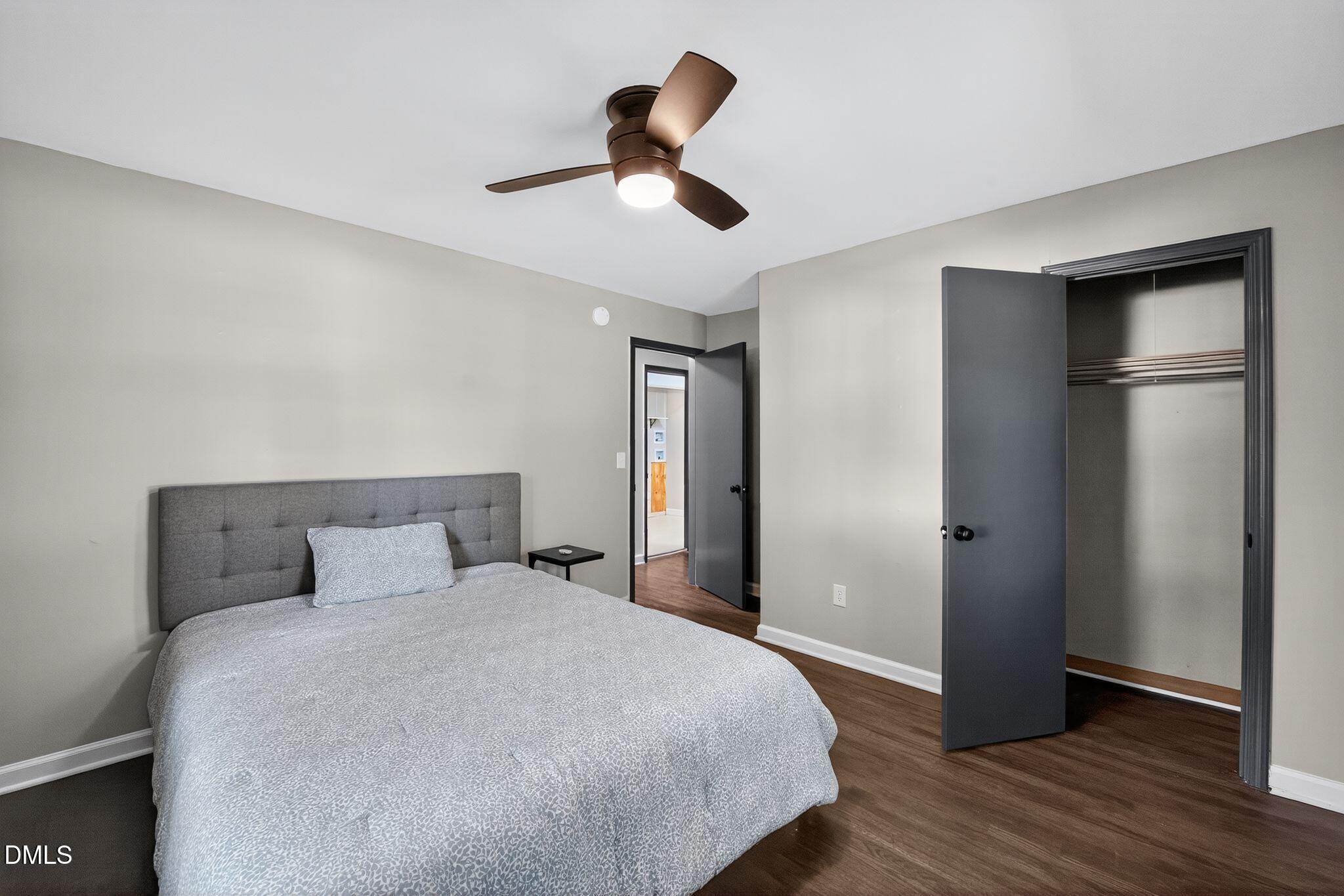 518 East 3rd Street Wendell, NC 27591 - Photo 20 of 30 a bedroom with a bed and a ceiling fan