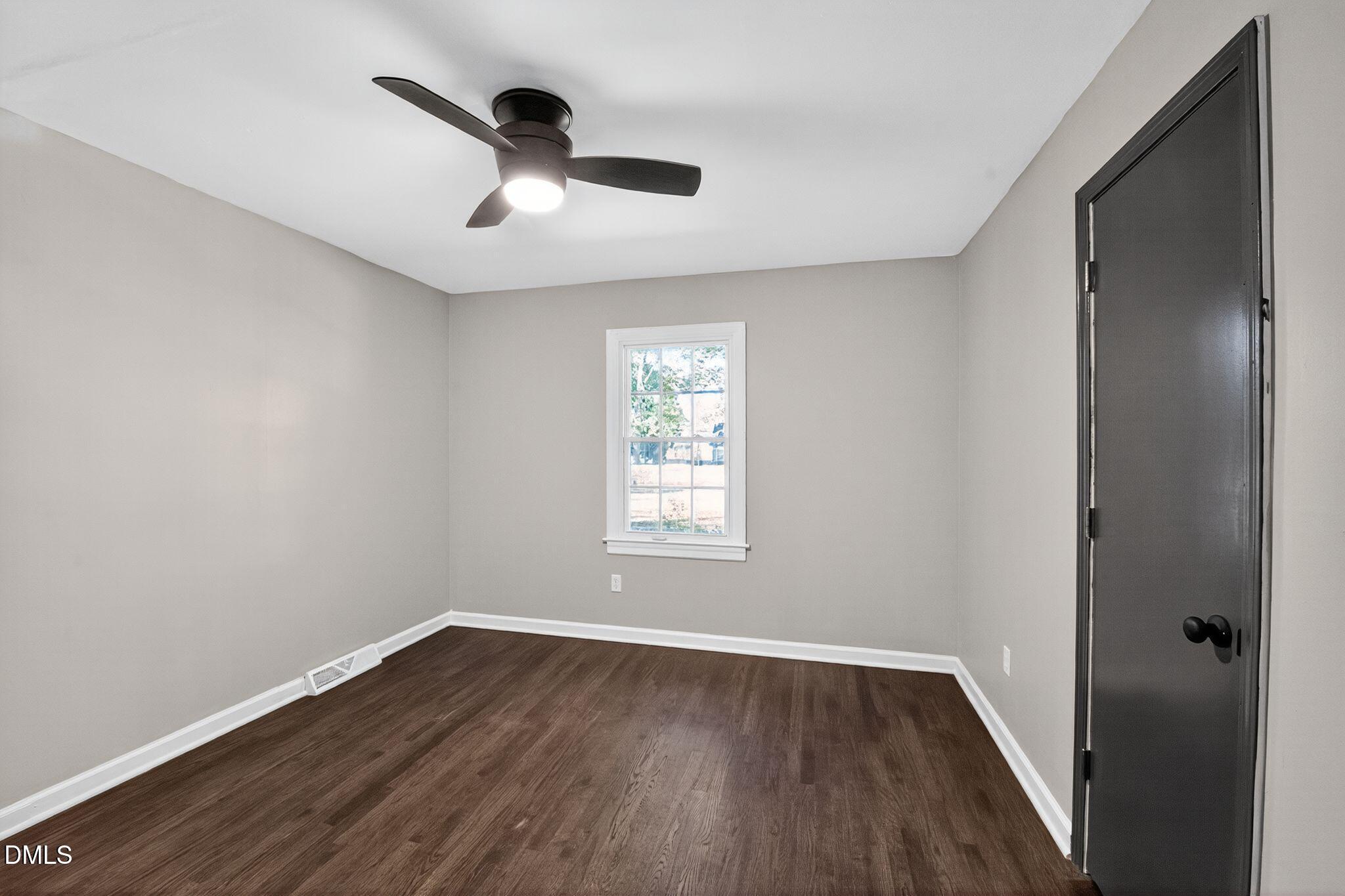518 East 3rd Street Wendell, NC 27591 - Photo 24 of 30 a view of empty room with wooden floor and fan