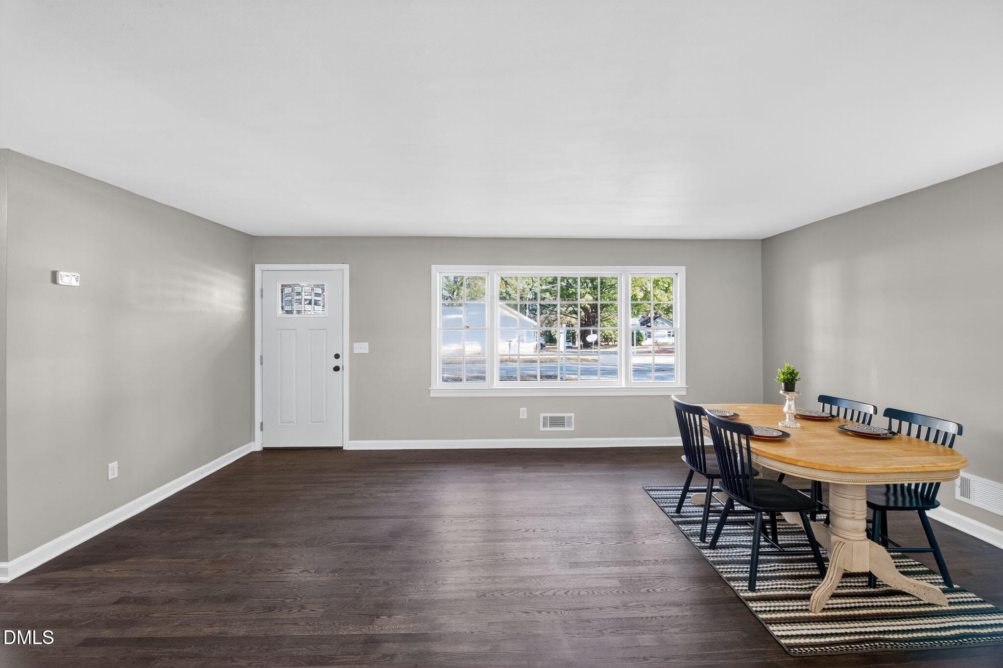 518 East 3rd Street Wendell, NC 27591 - Photo 9 of 30 a view of a room with furniture window and wooden floor