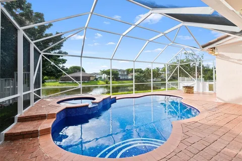 a view of a swimming pool with a lounge chair