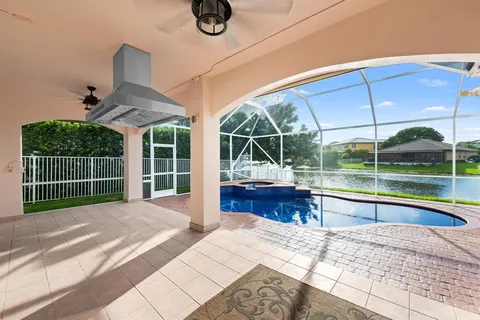a view of a house with a backyard and a porch