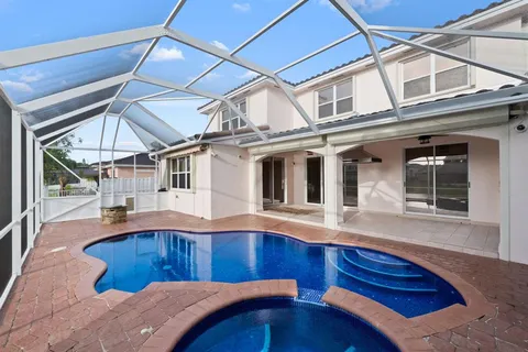 a bedroom with bed and balcony