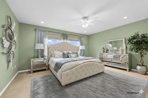 a bedroom with a large bed and a window