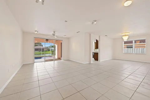 a view of an empty room and a window
