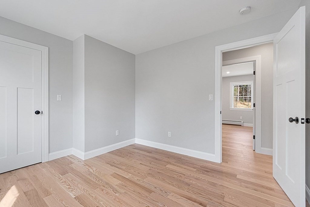 245 Brookside Road Orange, MA 01364 - Photo 15 of 29 a view of a room with wooden floor and a bathroom