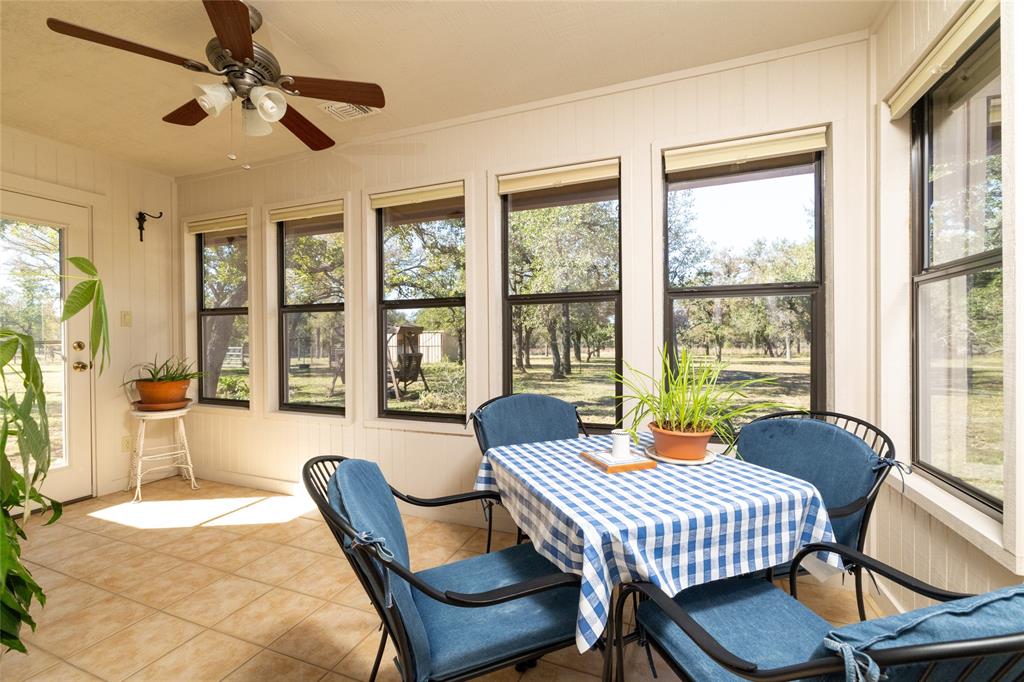 970 Live Oak Road Santo, TX 76472 - Photo 24 of 40 a dining room with furniture a chandelier and window