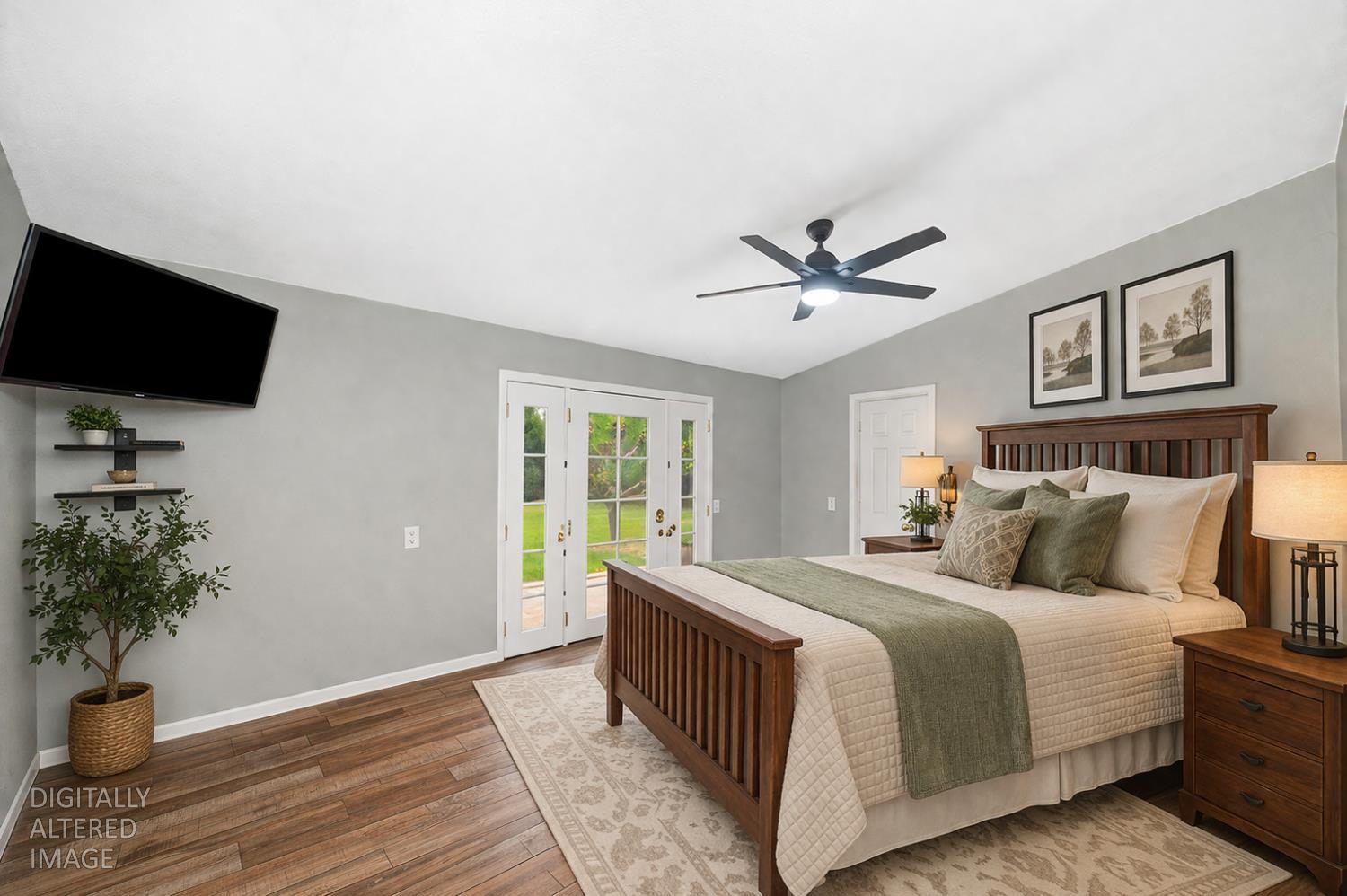 5682 Virginiatown Road Newcastle, CA 95658 - Photo 11 of 56 Primary suite with access to back patio, vaulted ceiling, updated floors, and ceiling fan.