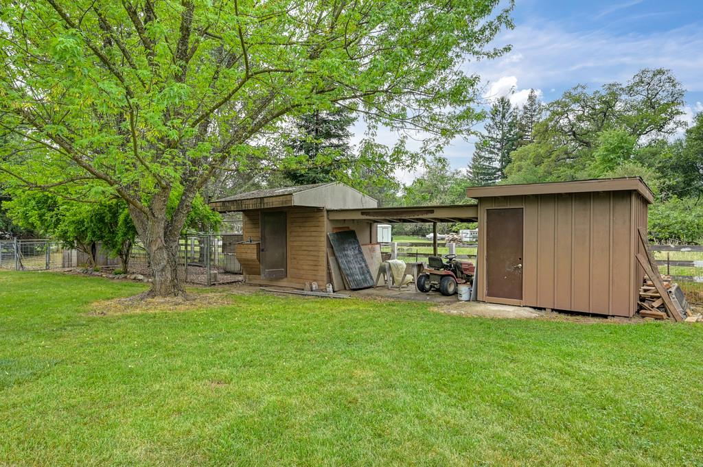 5682 Virginiatown Road Newcastle, CA 95658 - Photo 38 of 56 Chicken coop with nesting boxes, covered storage area and enclosed storage.