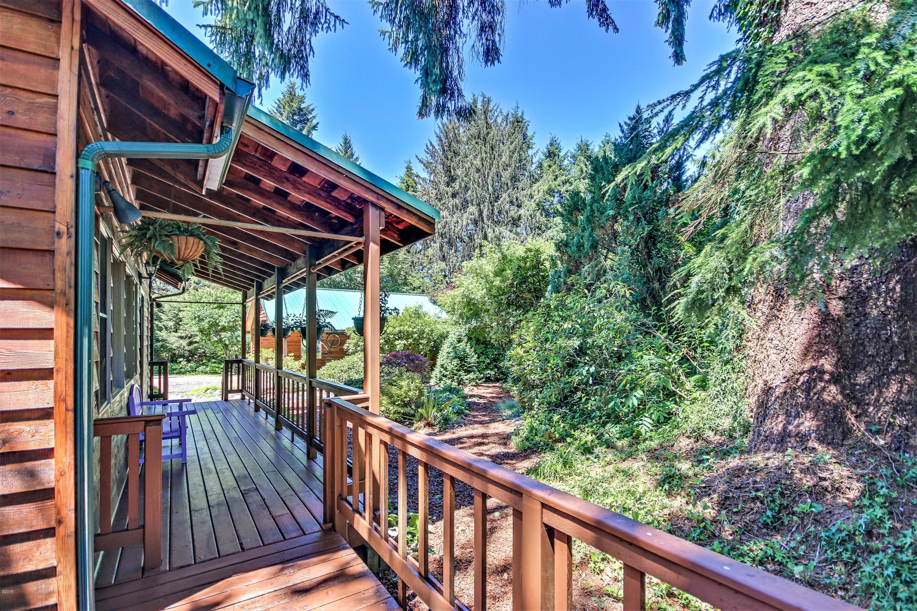 1754 Old River Road Northeast Siletz, OR 97380 - Photo 38 of 42 Beautiful Decks surround the home