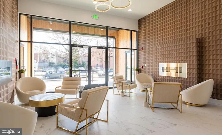 520 South Caroline Street, Unit 102 Baltimore, MD 21231 - Photo 16 of 18 a living room with furniture and a large window