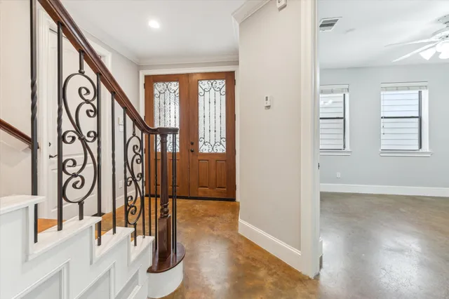 a view of an entryway with wooden floor