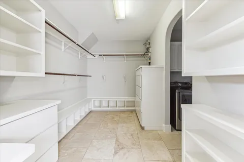a kitchen with stainless steel appliances granite countertop a sink and a stove