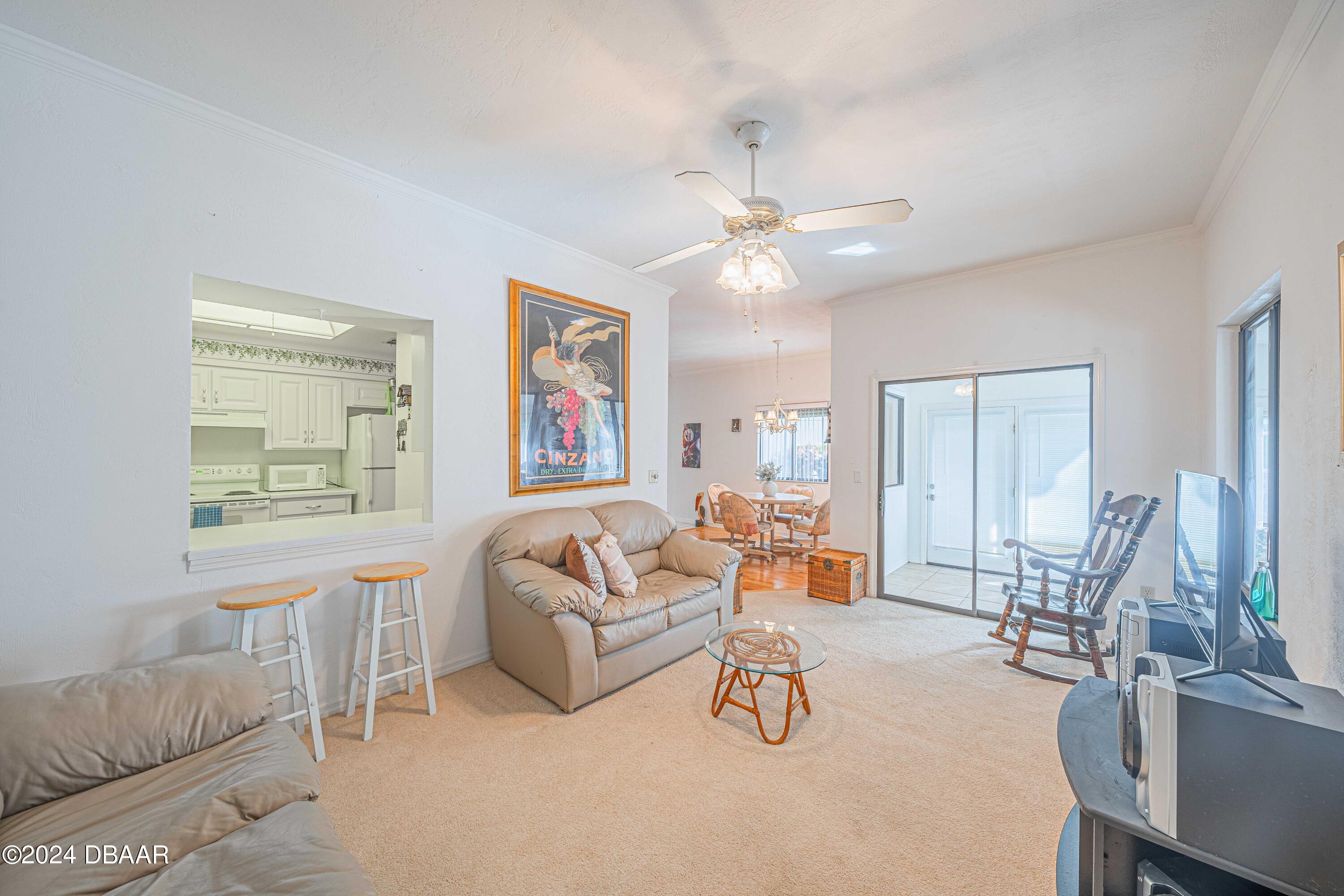 42 Jana Drive Ponce Inlet, FL 32127 - Photo 14 of 34 a living room with furniture and a large window