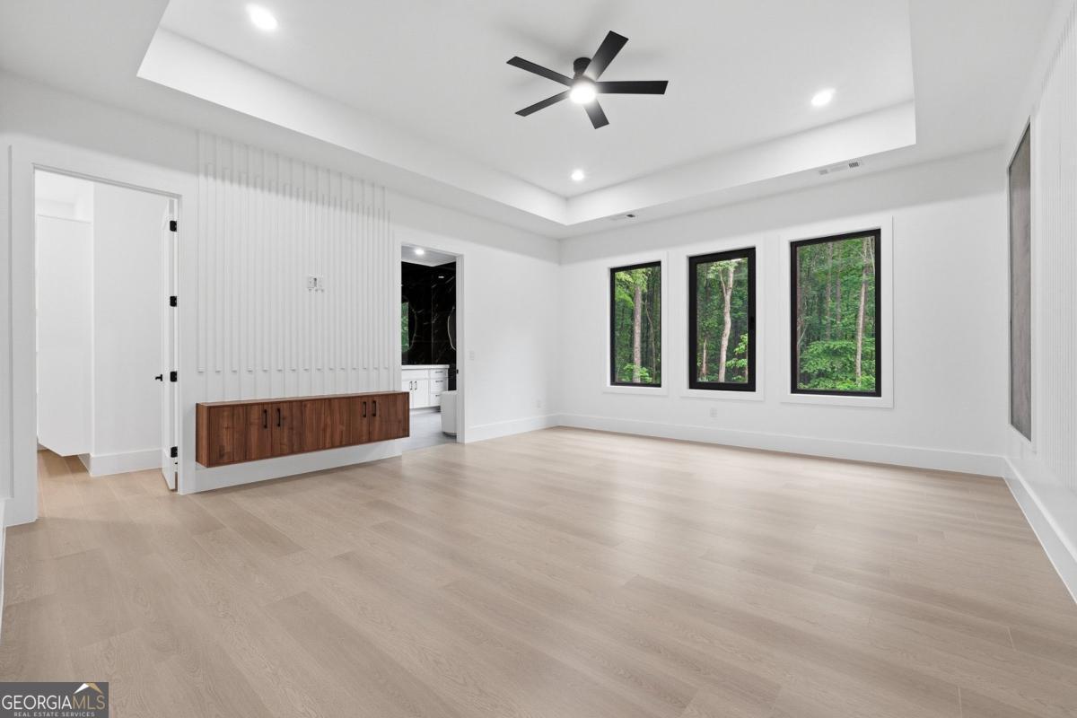 1563 Whitley Road Bethlehem, GA 30620 - Photo 16 of 44 a view of an empty room with a window and a ceiling fan