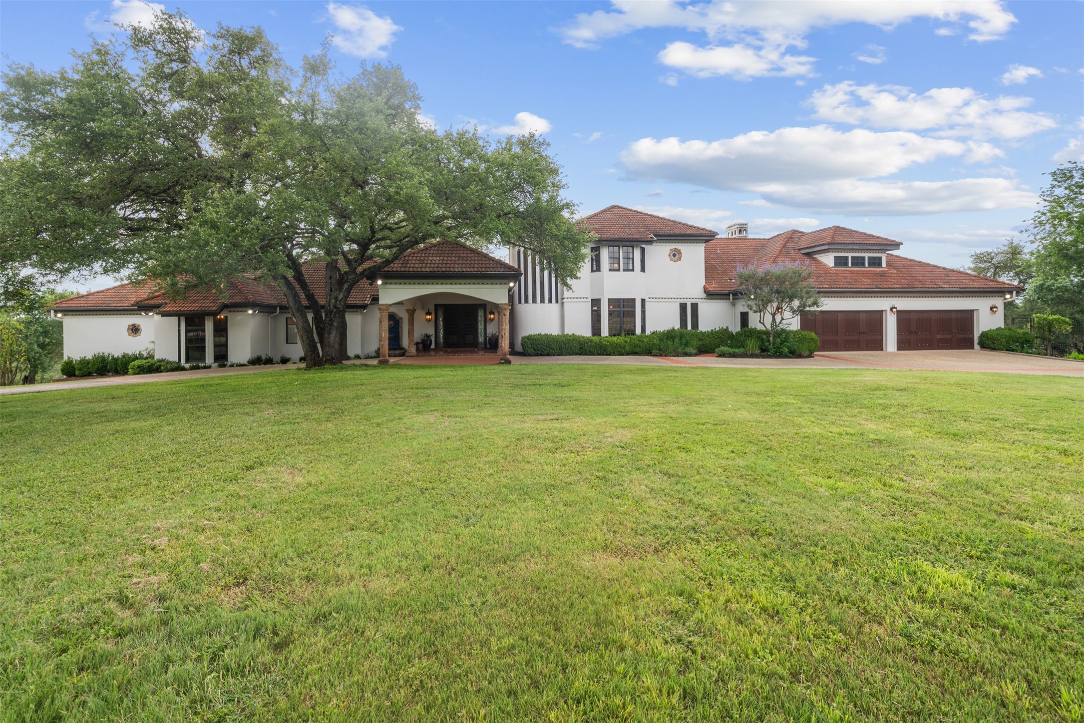 34000 Smithson Valley Road Bulverde, TX 78163 - Photo 1 of 50 A private Mediterranean-inspired estate framed by majestic live oaks, featuring authentic stucco architecture, a tile roof, and timeless curb appeal. The expansive lawn and estate-scale setting create an impressive first impression.