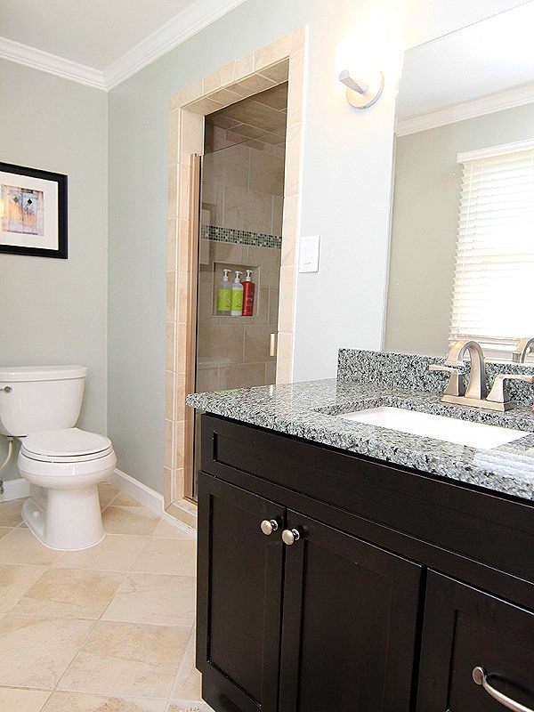 4513 Connell Drive Raleigh, NC 27612 - Photo 11 of 21 Remodeled master Bath has granite and updated tile. Upstairs master Bath