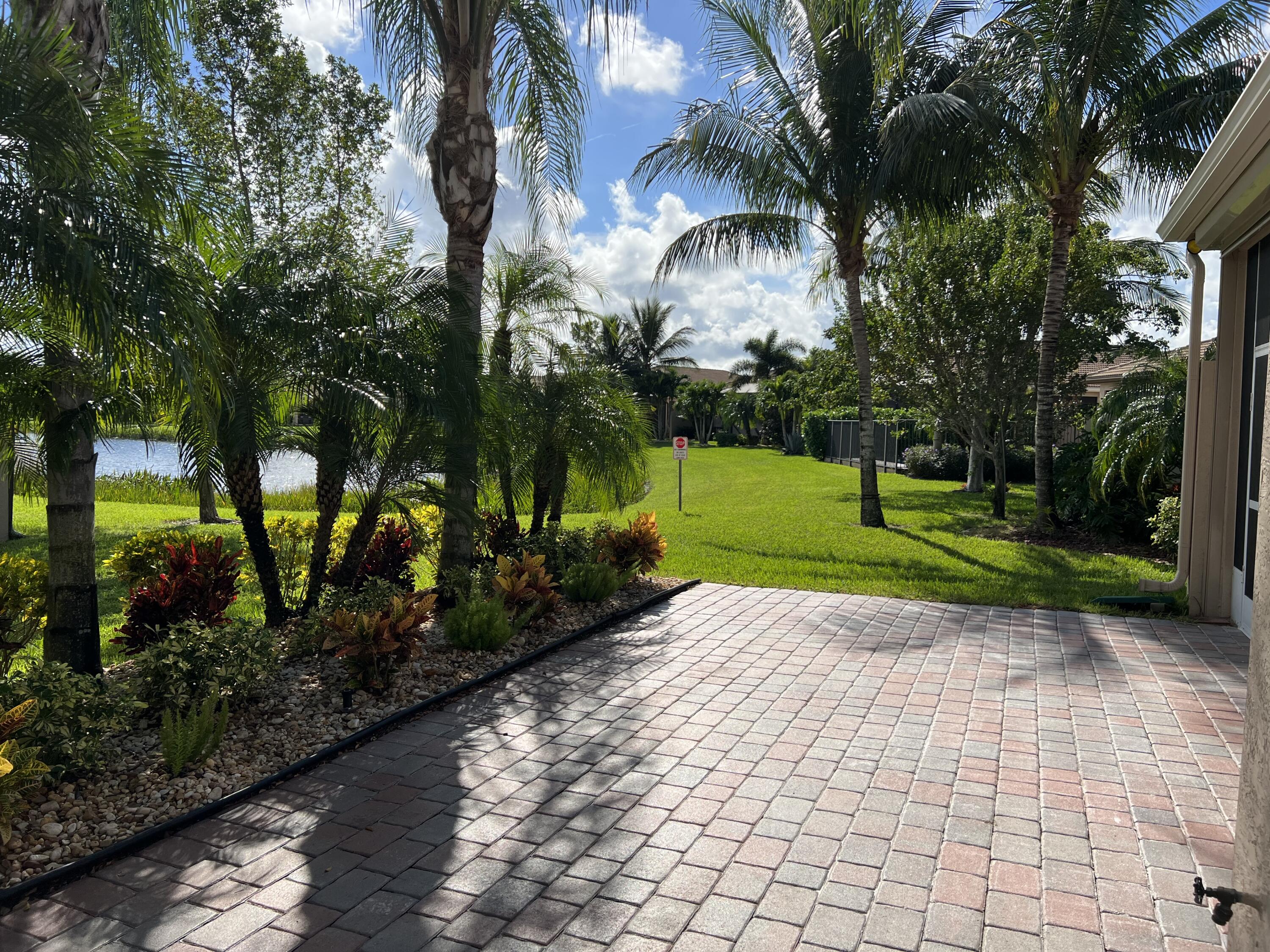 8375 Cloud Peak Drive Boynton Beach, FL 33473 - Photo 25 of 51 OPEN PATIO OVERLOOKIMG LAKE