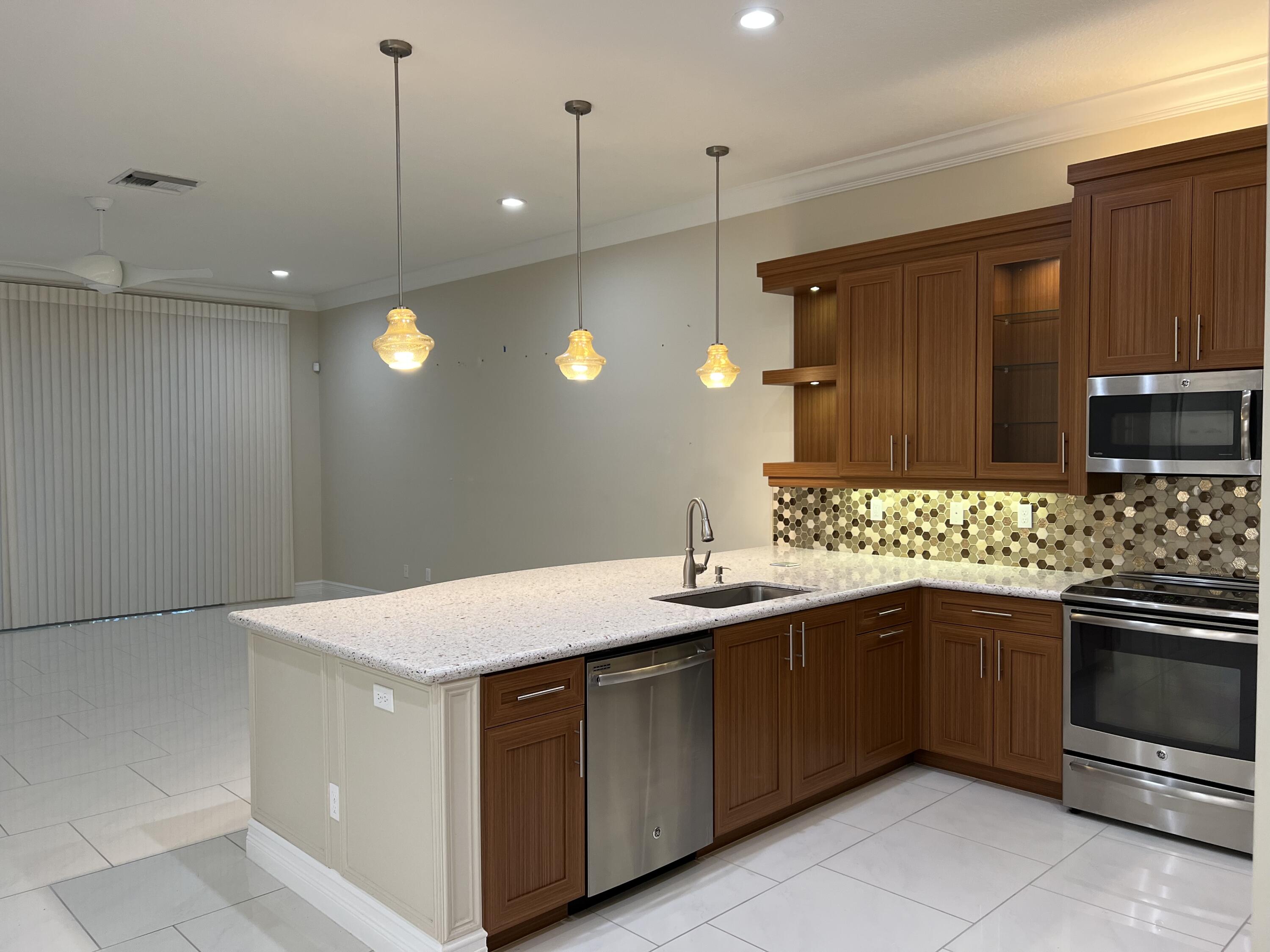 8375 Cloud Peak Drive Boynton Beach, FL 33473 - Photo 5 of 51 GOURMET KITCHEN & GREAT ROOM